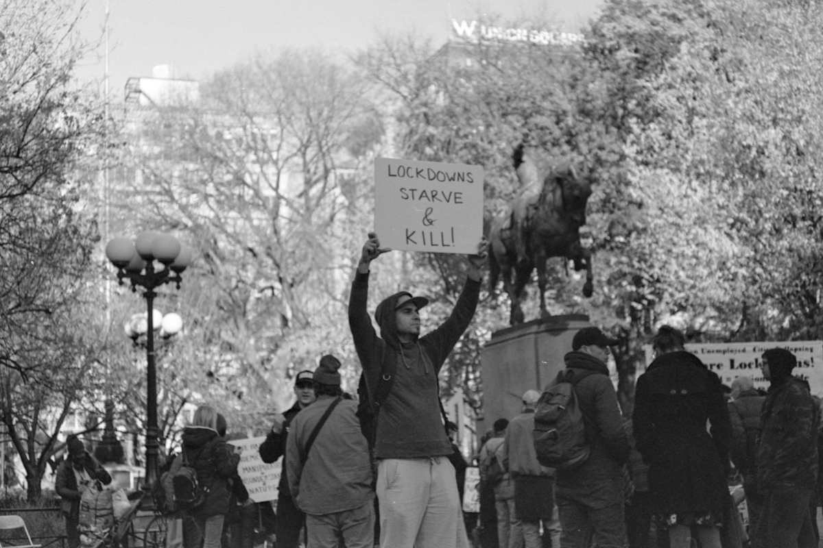 person holding a sign at protest